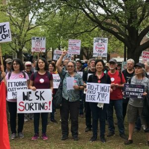 Diverse group of activists rallying for social justice in a community park
